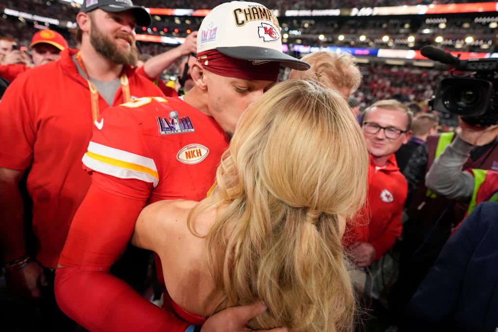 The couple kissed on the field at Allegiant Stadium on Feb. 11, 2024.