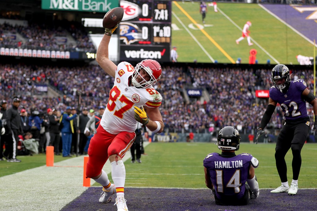 Travis Kelce spikes the ball after a touchdown against the Ravens in the AFC Championship game.