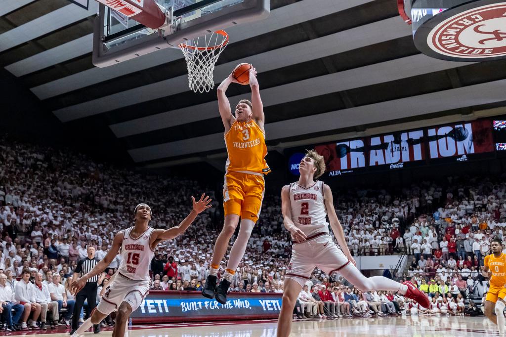 Tenessee guard Dalton Knecht (3) dunks past Alabama forwards Jarin Stevenson (15) and Grant Nelson (2) during the first half of an NCAA college basketball game, Saturday, March 2, 2024, in Tuscaloosa, Ala. 