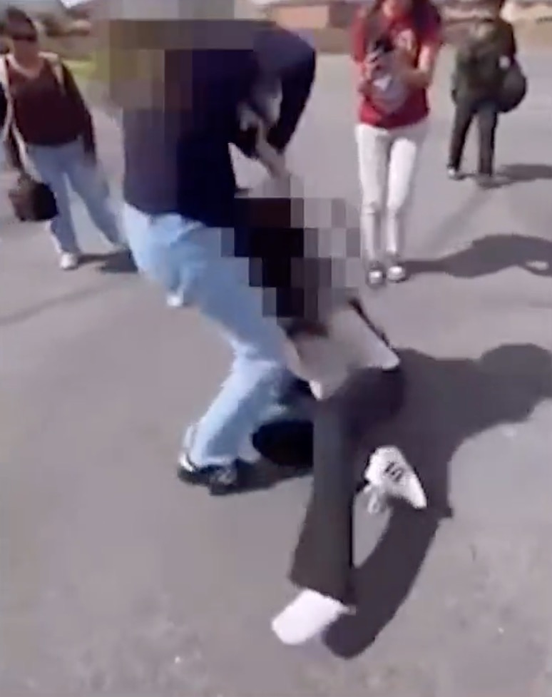 Screenshot from a video shows a sixth-grader at Arizona Middle School in Riverside County, Calif., being dragged on the ground and punched in the head