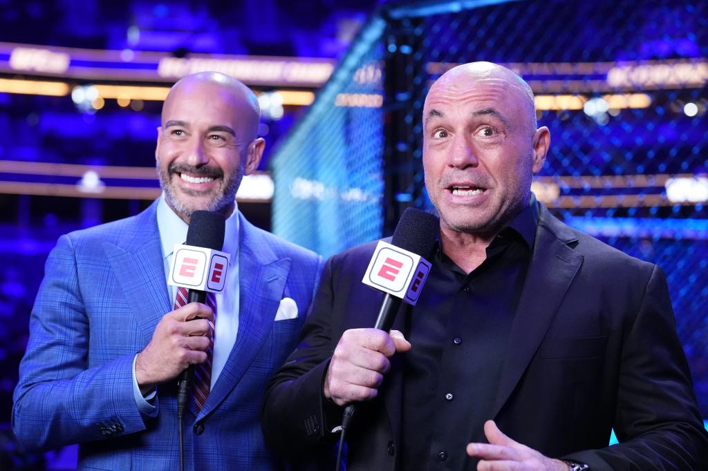 Jon Anik (left) and Joe Rogan (right) anchor the broadcast during the UFC 298 event at Honda Center on February 17, 2024 in Anaheim, California.