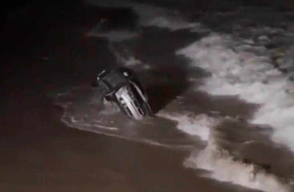 BMW seen rolling in the surf off Venice Beach on Saturday