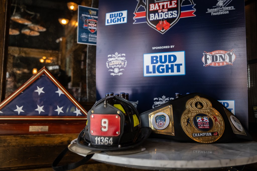 A Ladder 9 helmet and champion belt, which will be fought over Thursday, on display during the weigh-in.