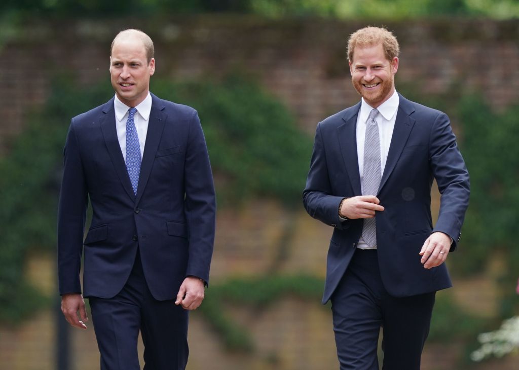 Prince William walking next to Prince Harry. 