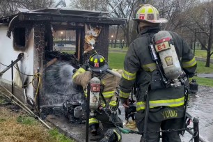 Bright orange flames engulfed a concession kiosk northwest of the memorial sometime after sunrise.