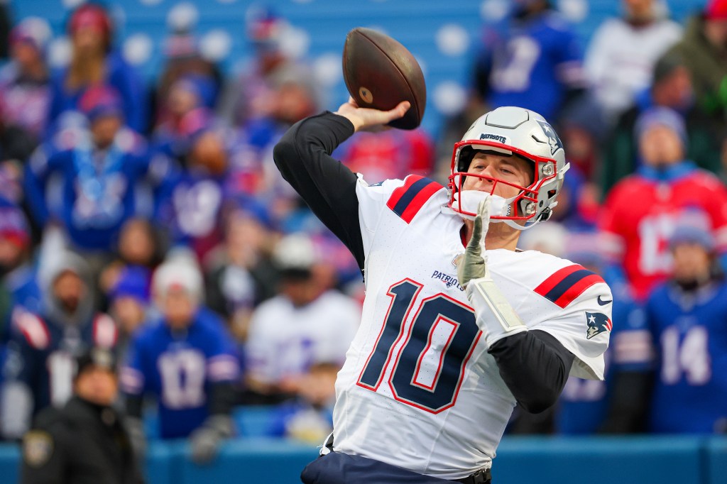 Mac Jones warms up for the Patriots in December 2023.