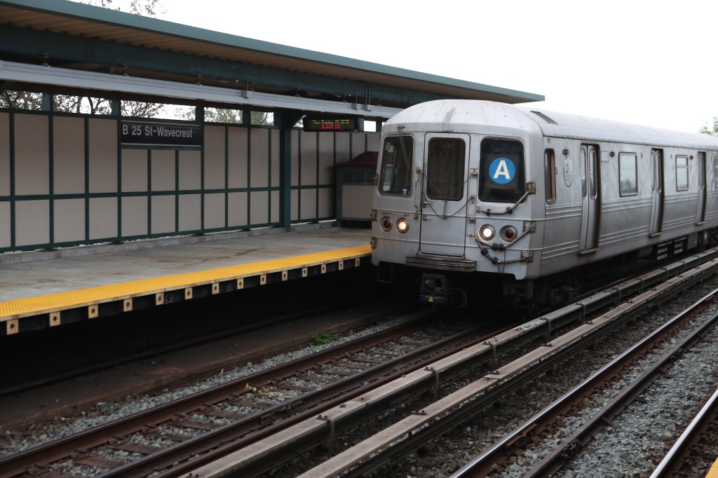 An A train seen on elevated subway tracks in the Rockaways.