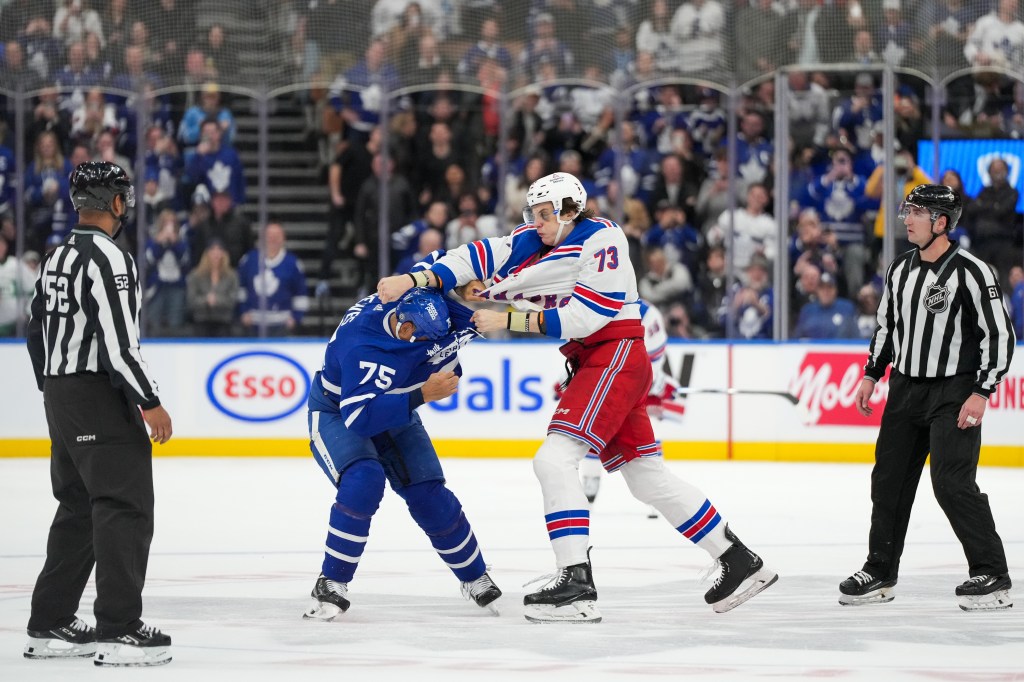 Rangers rookie Matt Rempe (73) fights with Maple Leafs forward Ryan Reaves (75).