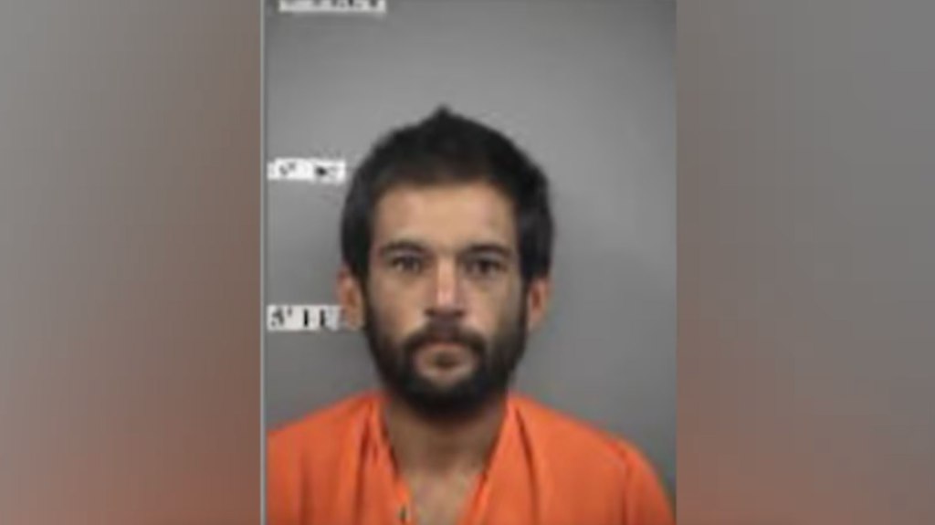 Mugshot of hawaii inmate Matthew J. Ornellas Jr. in orange jumpsuit