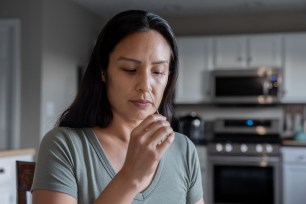 woman taking covid test