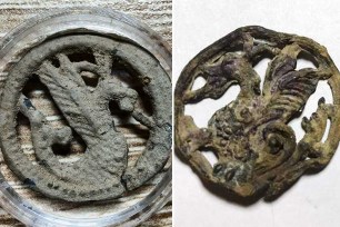 Metal detectorist in southeastern Poland holding an unearthed Christian pilgrim badge from the Middle Ages