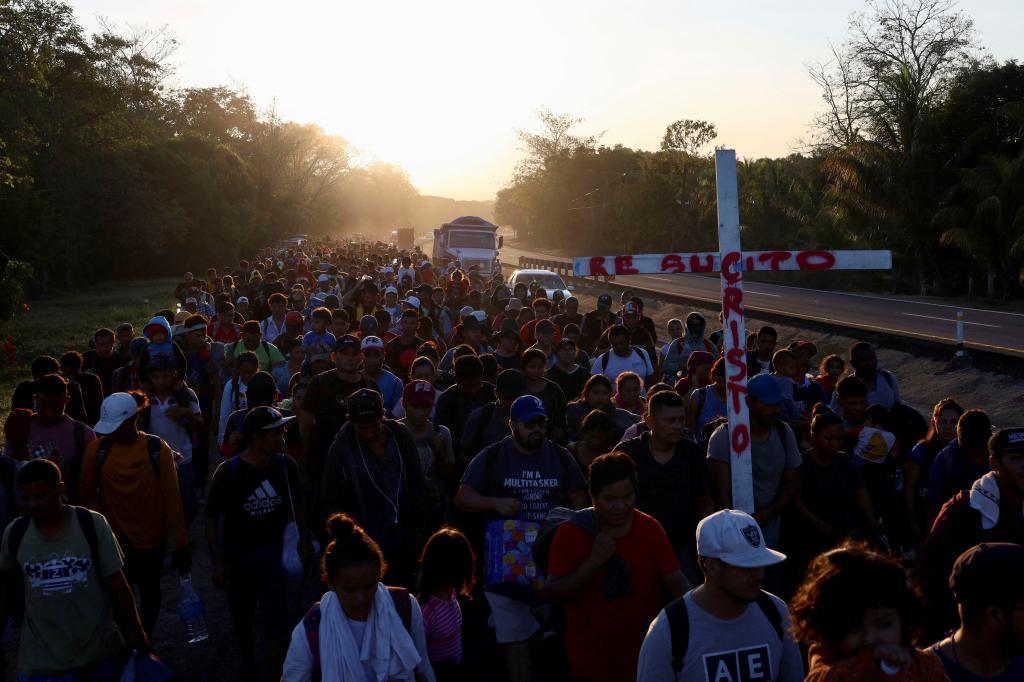 Migrants of different nationalities walk toward the U.S. border in a caravan called "The Migrant's Via Crucis", in Huixtla, Mexico March 27, 2024.