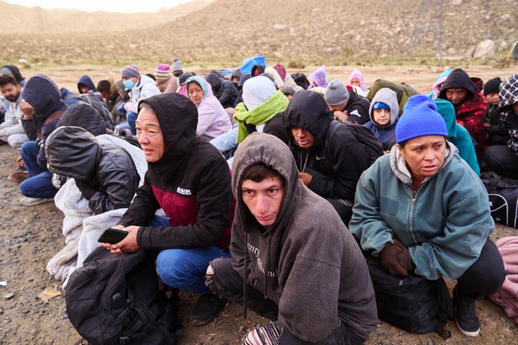 Migrants turned themselves into U.S. Customs and Border Protection officers at a makeshift camp after crossing  the U.S.-Mexico border wall on Monday, February 19, 2024 near Jacumba Hot Springs, California.   (James Keivom for New York Post)