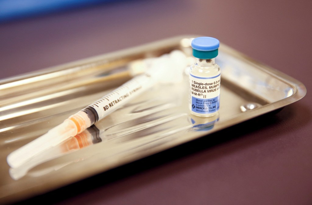 vaccine and needles on tray