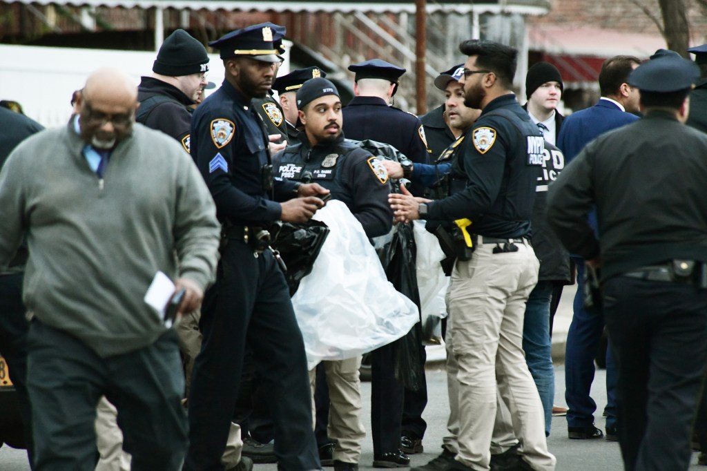 NYPD officers investigate scene of officer-involved shooting in Brooklyn.