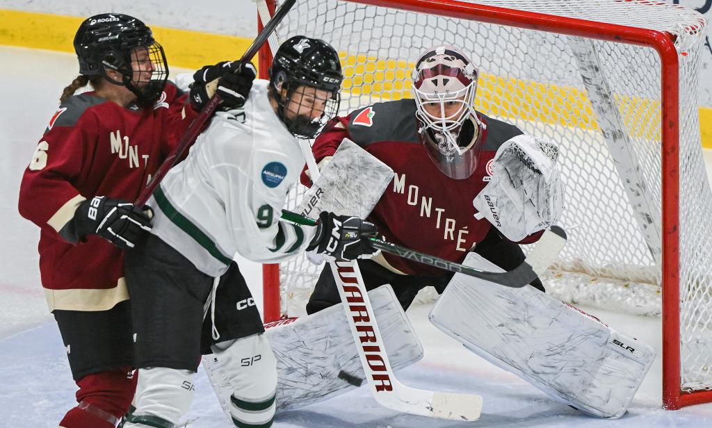 Sophie Shirley (9) moves in on Montreal goaltender Elaine Chuli, right, as Montreal's Madison Bizal (6) defends during the second period of a PWHL hockey game.