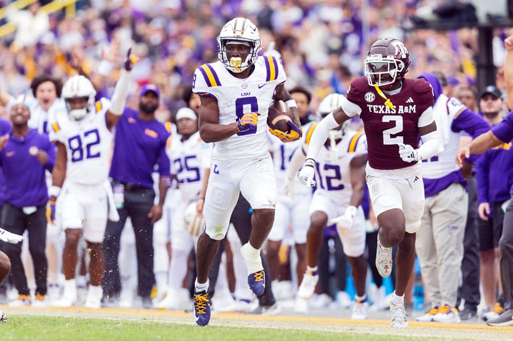 LSU Tigers wide receiver Malik Nabers (8) catches a pass during a game between the Texas A&M Aggies and the LSU Tigers in Tiger Stadium in Baton Rouge, Louisiana on November 25, 2023.