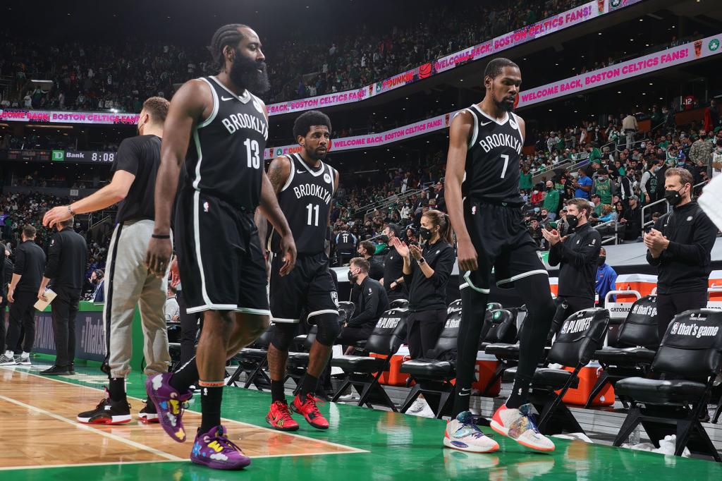 James Harden #13, Kyrie Irving #11 and Kevin Durant #7 of the Brooklyn Nets walk off the court at halftime during Round 1, Game 4 of the 2021 NBA Playoffs on May 30, 2021 at the TD Garden in Boston, Massachusetts. 