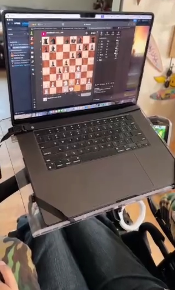 Online chess game on screen of a laptop