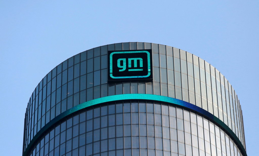 The new GM logo seen on the facade of General Motors headquarters with a smaller GM logo on top.