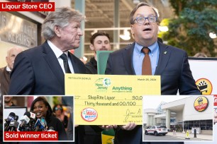 A man in a suit holding a lottery winning check in New Jersey