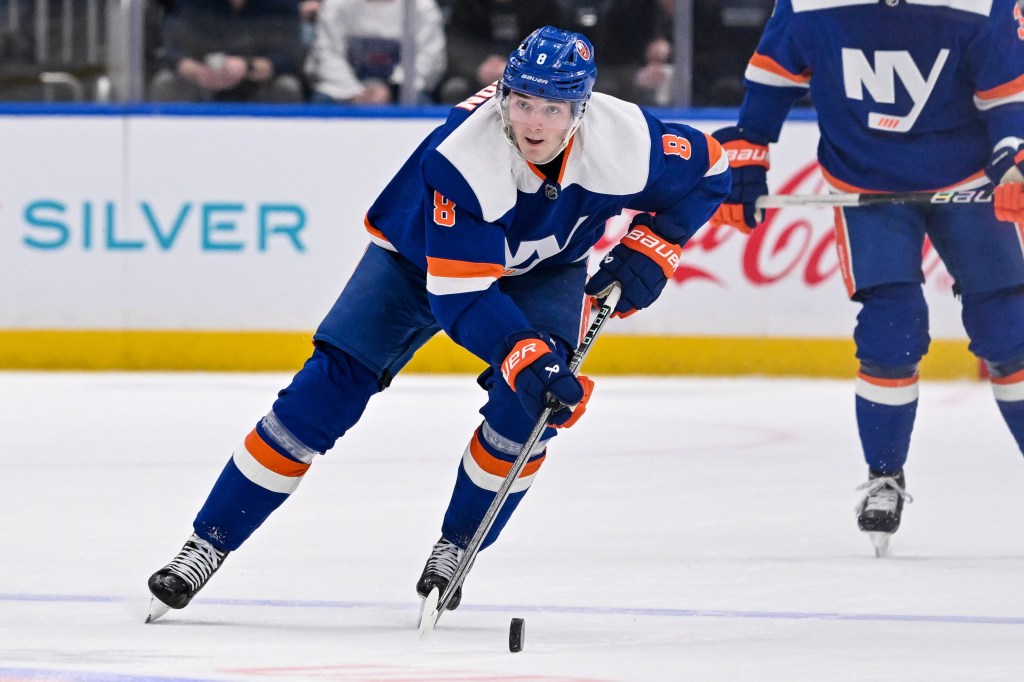 New York Islanders defenseman Noah Dobson (8) skating with puck against St. Louis Blues during second period at UBS Arena.