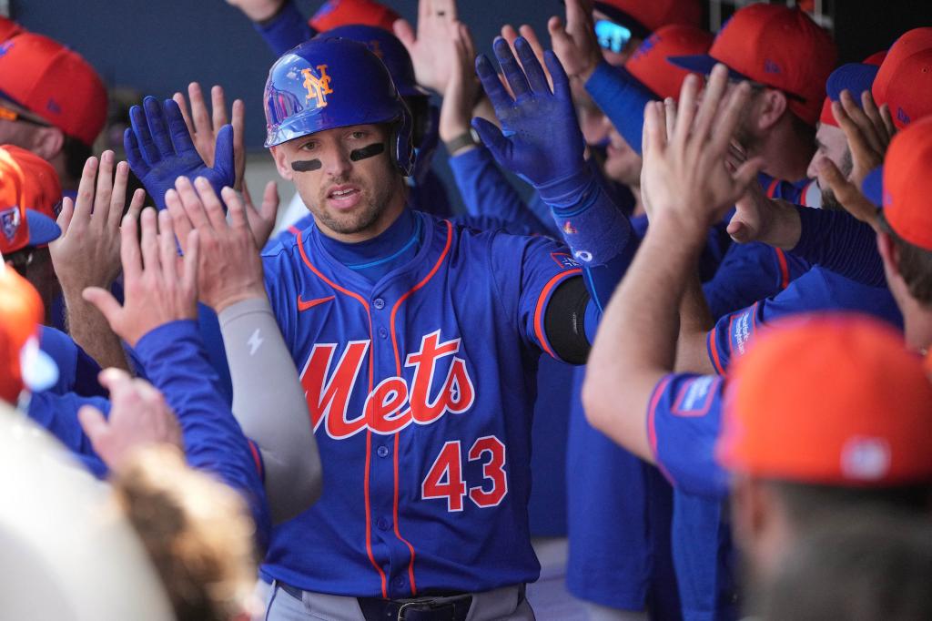 New York Mets left fielder Trayce Thompson (43) is congratulated by teammates after hitting a grand slam against the Washington Nationals in the third inning at CACTI Park of the Palm Beaches.