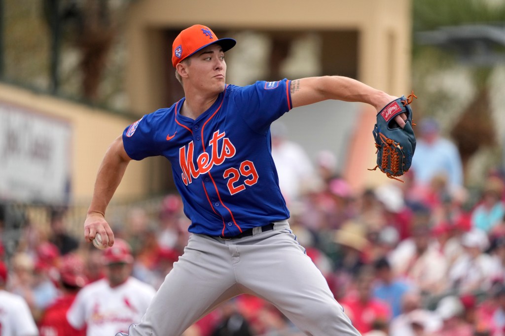 Blade Tidwell throws during the third inning of a spring training baseball game against the St. Louis Cardinals.