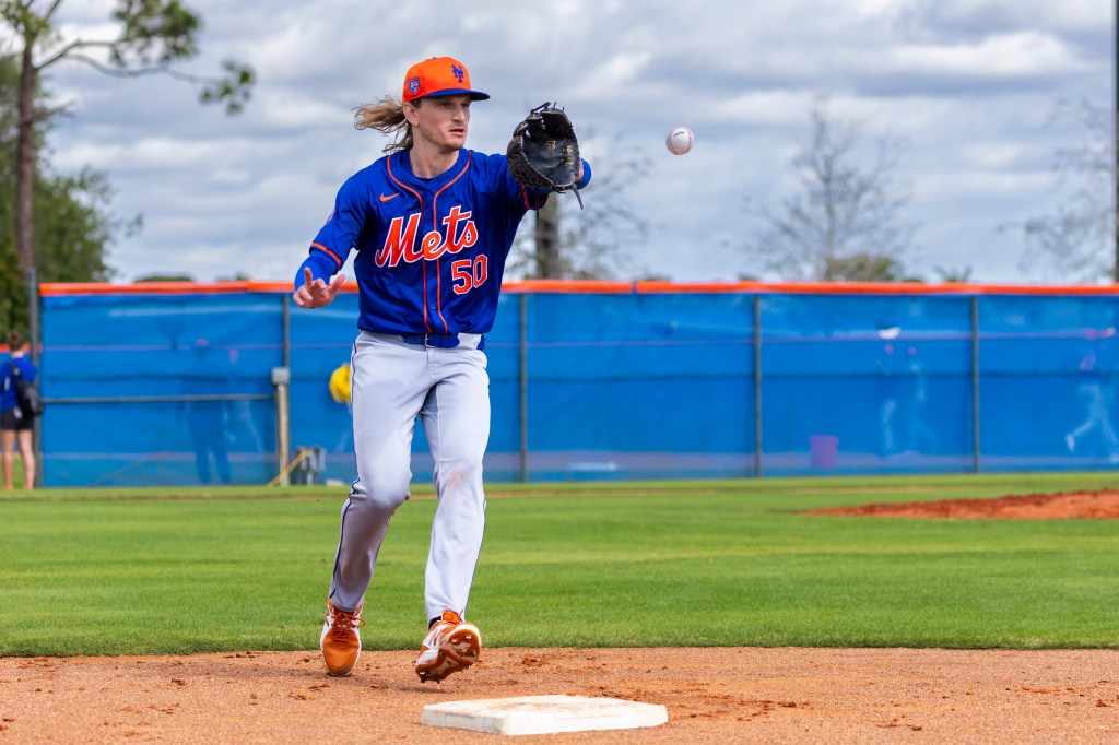 Mets relief pitcher Phil Bickford runs a drill at Spring Training.