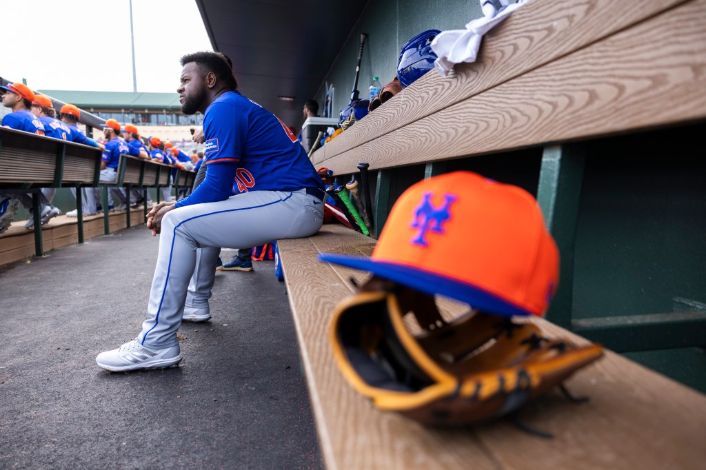New York Mets starting pitcher Luis Severino sits in the dugout before a game against the St. Louis Cardinals