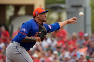 New York Mets starting pitcher Sean Manaea throwing a ball during a spring training baseball game against the St. Louis Cardinals