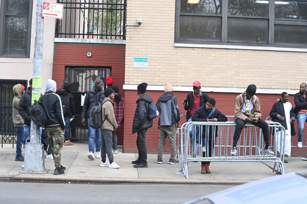 A line of migrants waiting to apply for shelter outside of St. Brigid's School on March 15, 2024.