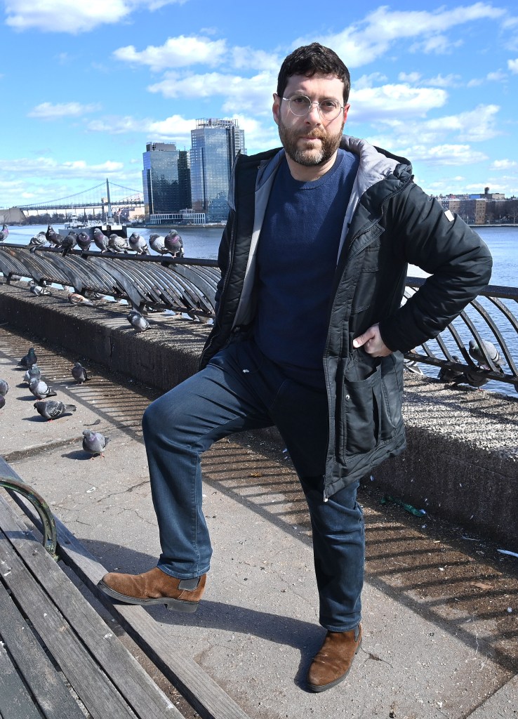 A picture of Mike Volfman at a bench in the park