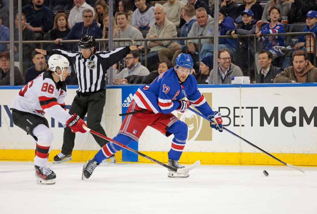 Rangers left wing Alexis Lafreniere moves the puck down ice on Monday.