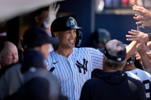 New York Yankees' Giancarlo Stanton celebrates after scoring in the second inning of a spring training baseball game against the Atlanta on Sunday.