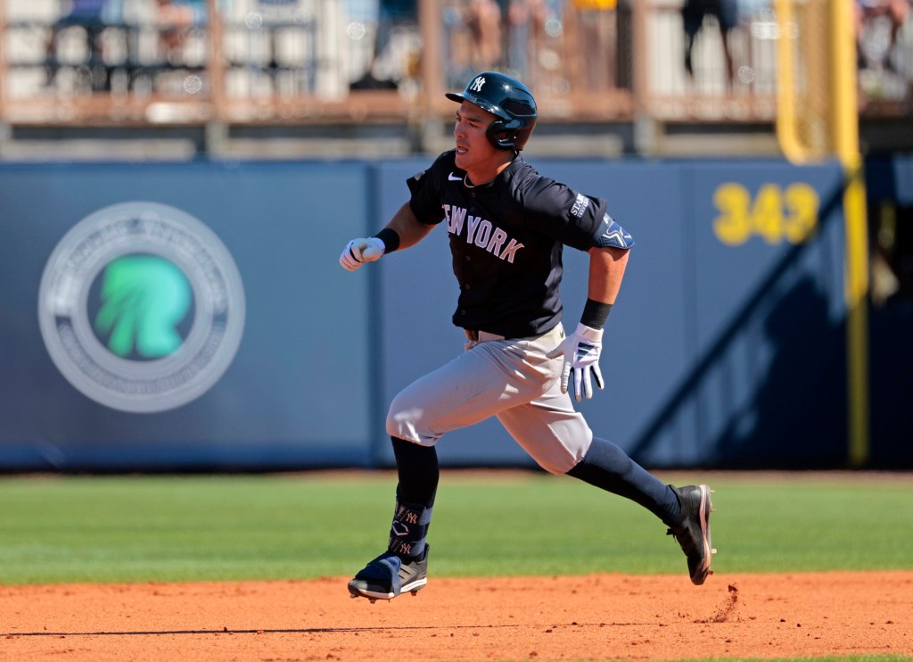 Yankees shortstop Anthony Volpe #11, running the bases after hitting a triple in the 6th inning against the Rays.