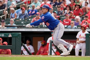 Ji Man Choi belts an RBI ground-rule double in the first inning of the Mets' 9-3 exhibition win over the Cardinals.