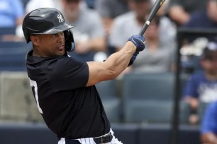 Giancarlo Stanton belts a two-run homer during the Yankees' 10-9 exhibition win over the Blue Jays.