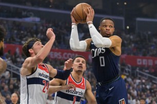 Russell Westbrook, who later left with a broken left hand, looks to make a pass during the Clippers' 140-115 win over the Wizards.