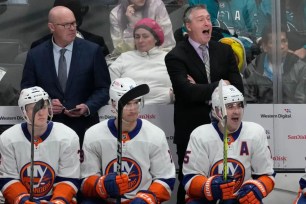 Patrick Roy (right) yells out instructions during the Islanders' 7-2 win over the Sharks.
