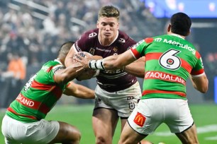 Sea Eagles' Reuben Garrick runs at Richard Kennar (left) and Cody Walker during their 36-24 win over the Rabbitohs.