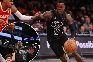 Dennis Schröder and Dejounte Murray holding a basketball.