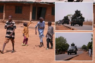 Children walk past classrooms at the LEA Primary and Secondary School