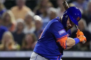 DJ Stewart ducks out of the way of a pitch during the fifth inning of the Mets' 3-1 exhibition win over the Marlins.