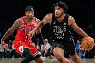 Cam Thomas, who scored a team-high 28 points, drives past Torrey Craig during the Nets' 125-108 win over the Bulls.