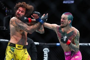 Sean O'Malley punches Marlon Vera during his win in the UFC 299 bout.