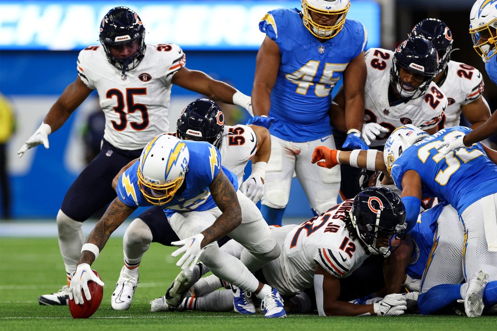 keenan Allen (13) of the Los Angeles Chargers recovers an onside kick during an NFL football game against the Chicago Bears