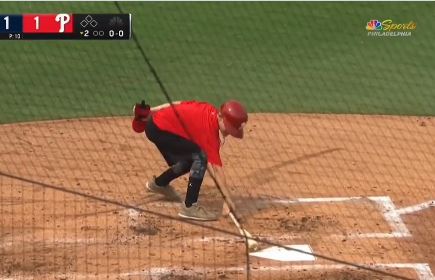 Liam Castellanos retrieves his dad's bat on Saturday.