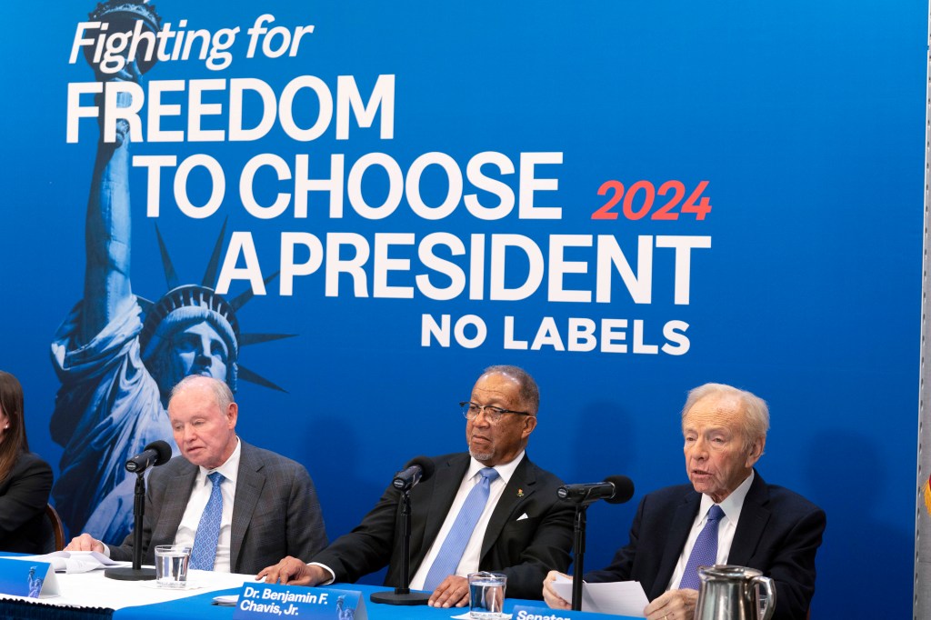 No Labels leadership and guests from left, Dan Webb, National Co-Chair Dr. Benjamin F. Chavis, and founding Chairman and former Sen. Joe Lieberman, speak about the 2024 election at National Press Club, in Washington, Jan. 18, 2024.
