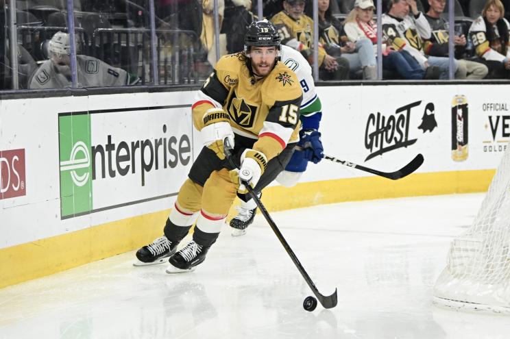 Noah Hanifin #15 of the Vegas Golden Knights skates with the puck against the Vancouver Canucks.